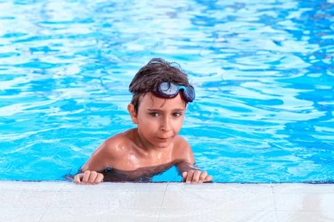 Portrait of the boy in the pool Stock Photos