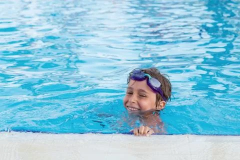 Portrait of the boy in the pool Stock Photos