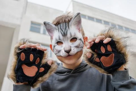 Portrait of a boy quadrober in a mask, against the background of the city Stock Photos