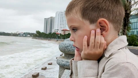 Portrait of boy thoughtfully watching on waves. Stock Footage 266235072