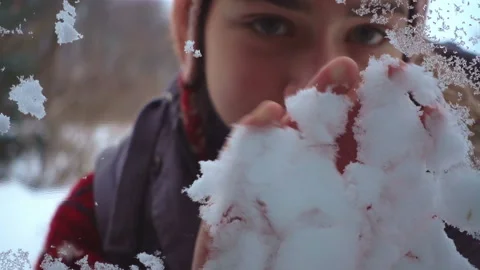 Portrait of a boy through a glass window outside in winter in slow motion. Stock-Footage 101511795