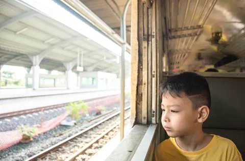 Portrait of a boy on the train Looking outside the window views Stock Photos