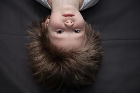 Portrait of a boy upside down Stock-Fotos