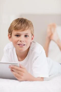 Portrait of a boy using a tablet computer 写真素材