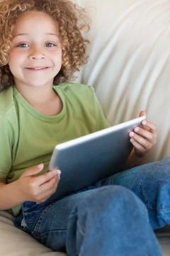 Portrait of a boy using a tablet computer Stockfoto's