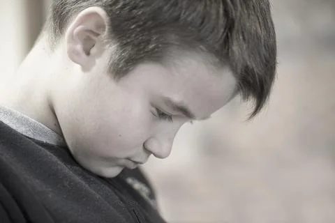 Portrait of a boy who looking down Stock Photos