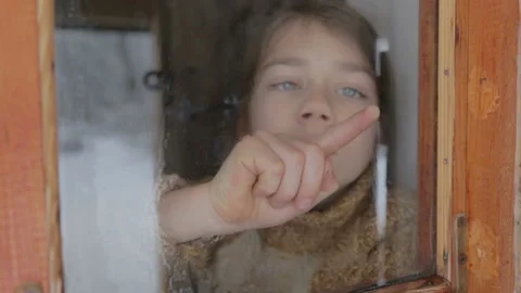 Portrait of a boy in the window at home isolated, set of video clips. Stock Footage 149988884