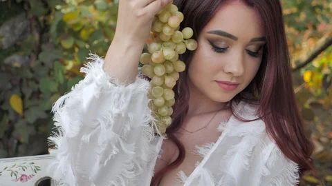 Portrait of the bride with grapes Stock Footage 129291115