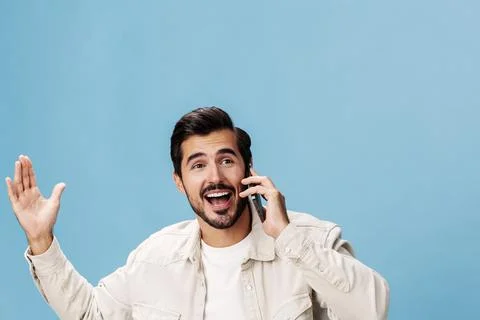 Portrait of a brunette man animation and joy talking on the phone hand and fist Stock Photos