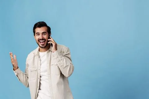 Portrait of a brunette man animation and joy talking on the phone hand and fist Stock Photos