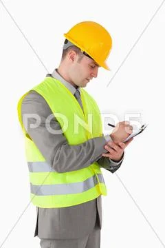 Portrait of a builder taking notes Stock Photos