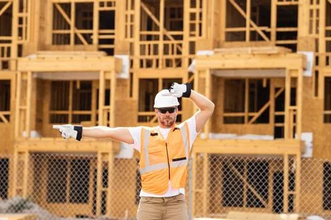 Portrait of Builder Worker Contractor Wearing Hard Hat and Safety Vest Stock Photos