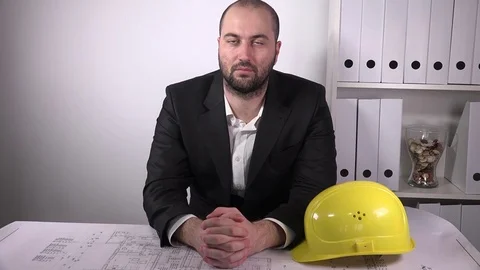 Portrait of business man engineer looking camera inside office architect desk 4K Stock Footage 72900525