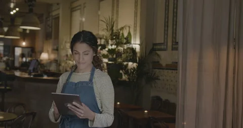 Portrait of Business Owner using Digital tablet and Looking at camera Stock Footage 247082610