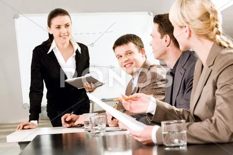 Portrait Of Business People Discussing A New Strategy At A Seminar