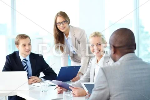 Portrait of business team working at meeting Stock Photos