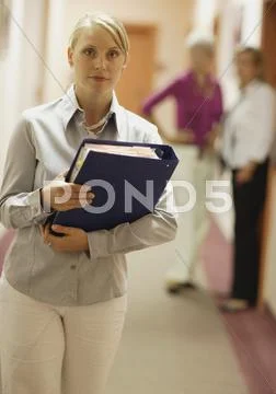 Portrait of business woman with business people in background Stock Photos