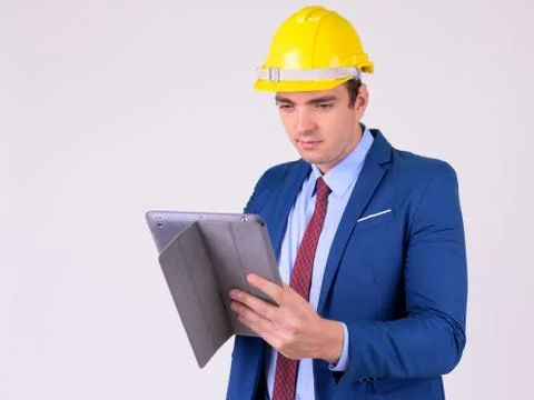 Portrait of businessman as engineer using digital tablet 스톡 사진