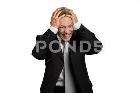 Portrait of businessman in full desperation. Stock Photos