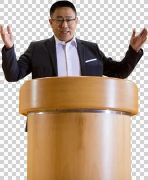 Portrait of businessman gesturing while giving speech at podium Stock Photos