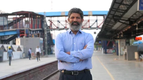 Portrait of a businessman posing for the camera standing at a railway station... Stock Footage 260803182