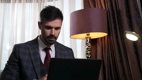 Portrait of businessman thinking during work at pc Video stock 148679312