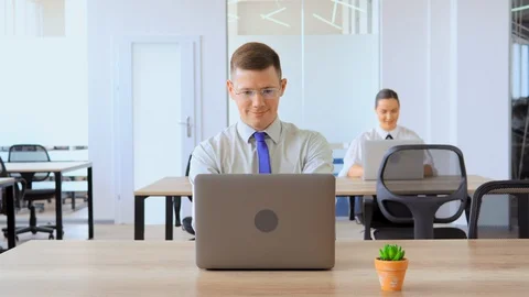 Portrait businessman using laptop at workplace Stock Footage 114814751