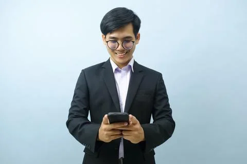 Portrait of businessman using smartphone. Stock Photos