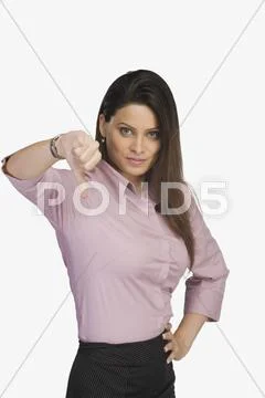 Portrait of a businesswoman showing thumbs down sign Stock Photos