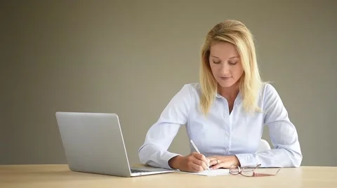 Portrait of businesswoman using laptop, isolated Stock Footage