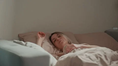 Portrait capturing tranquility and reflective mood in soft lighting. Intimate Stock Footage 337309904