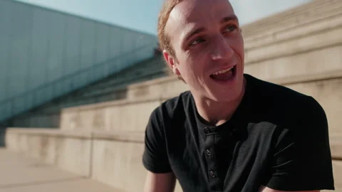 Portrait of a carefree student guy talking to friends. Cheerful young boy Stock Footage 314267172