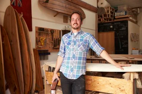 Portrait Of Carpenter In Bespoke Surfboard Workshop Stock Photos