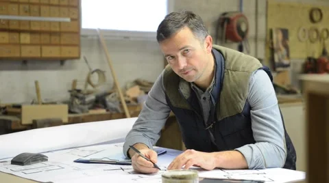 Portrait of carpenter designing plans Stock Footage 46764114