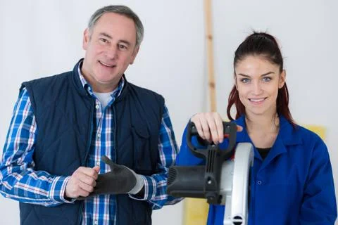 Portrait of carpentry apprentice and teacher Stock Photos
