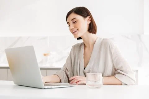 Portrait of caucasian adult woman wearing robe smiling and working, or chatti Stock Photos