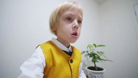 Portrait of a caucasian boy playing computer game emotionally at laptop Video stock 228695971
