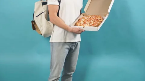 Portrait of caucasian delivery man holding pizza Stock Footage 124003853