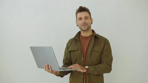 Portrait of Caucasian Developer with Laptop Isolated on White Background Stock Footage 277410934