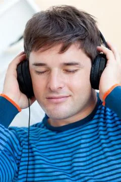 Portrait of a caucasian man listening music closing his eyes Stock Photos