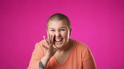 Portrait of caucasian non binary gender fluid woman 20s looks around put hand to Stock Footage 223698510