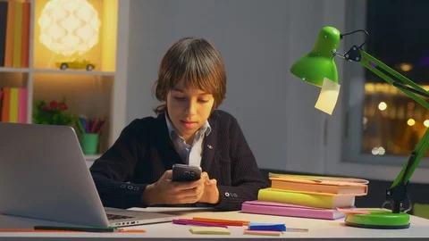Portrait of caucasian school boy using social network Stock Footage 98687281