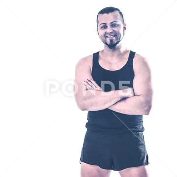 Portrait of charismatic trainer on bodybuilding on a light backg Stock Photos