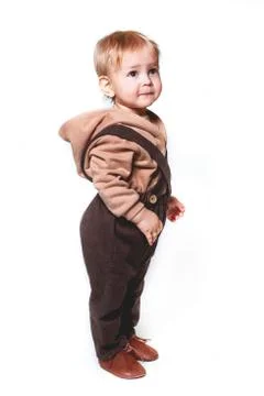Portrait of a charming one-year-old little boy on a white background, dressed Foto stock