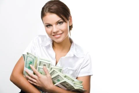 Portrait of charming woman holding dollars and looking at camera with smile Stock Photos