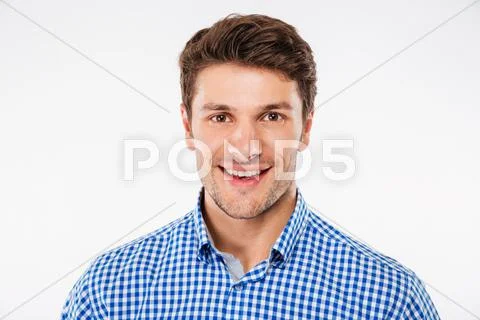 Portrait of cheerful attractive young man in checkered shirt Stock Photos