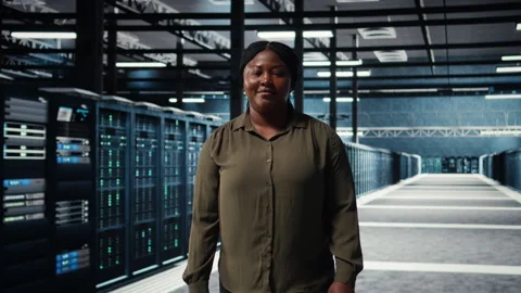 Portrait of cheerful data center engineer conducting security audits Stock Footage 317125494