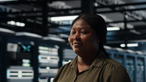 Portrait of cheerful data center engineer conducting security audits Stock Footage 317125667