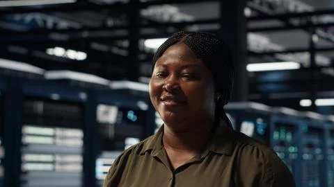 Portrait of cheerful data center engineer conducting security audits 스톡 사진