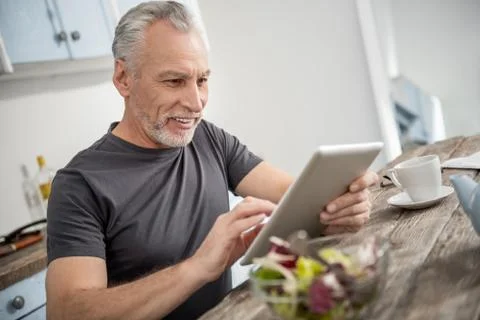 Portrait of cheerful man that checking email Stock Photos
